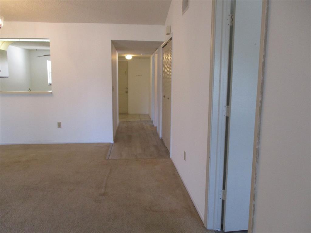 23442 Southwest 57th Avenue, Unit 406 Boca Raton, FL 33428 - Photo 23 of 25 a view of a hallway with closet area