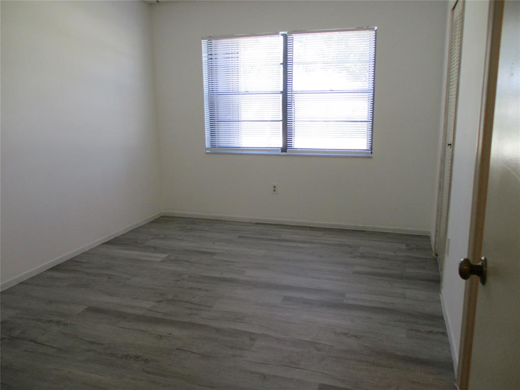 23442 Southwest 57th Avenue, Unit 406 Boca Raton, FL 33428 - Photo 10 of 25 an empty room with a window