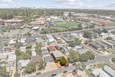an aerial view of residential houses with outdoor space