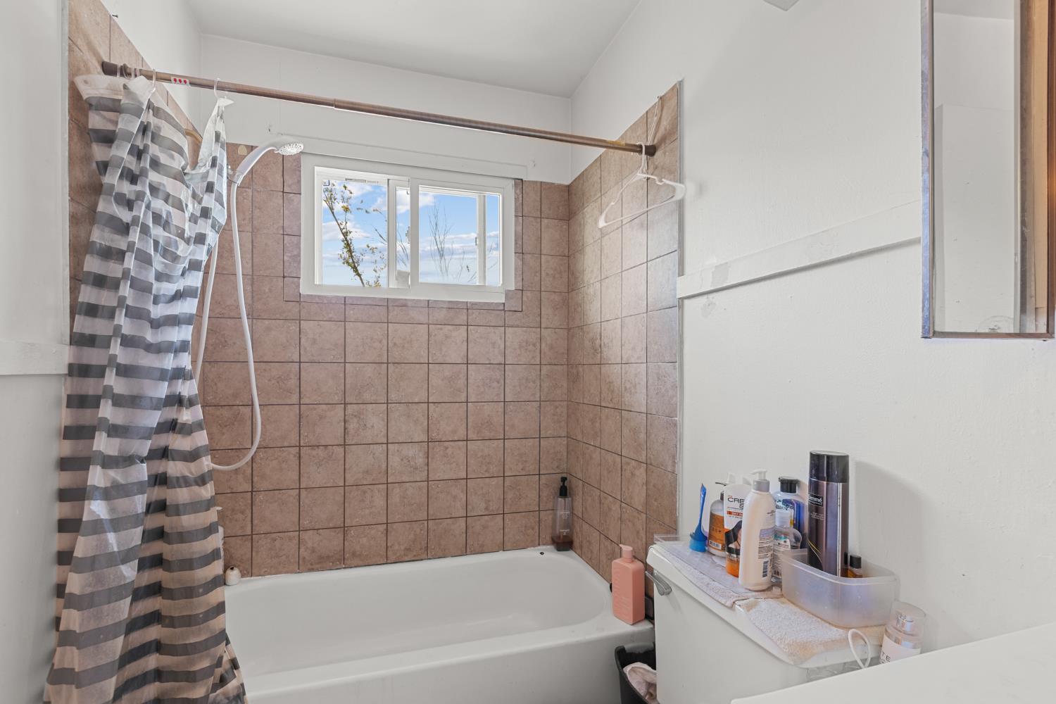 2123 15th Avenue Sacramento, CA 95822 - Photo 13 of 35 a bathroom with a bathtub and shower