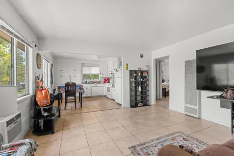 a view of living room with furniture and a flat screen tv