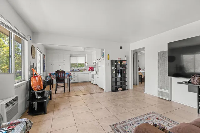 a view of living room with furniture and a flat screen tv