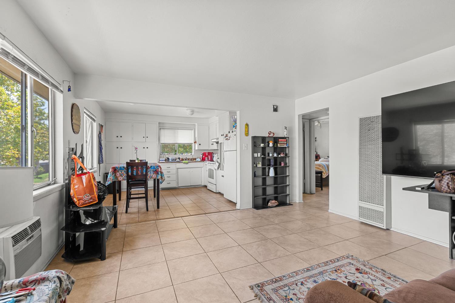 2123 15th Avenue Sacramento, CA 95822 - Photo 16 of 35 a view of living room with furniture and a flat screen tv
