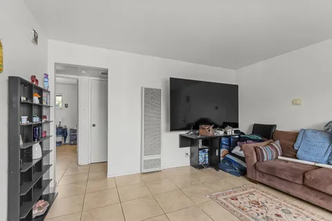 a view of a livingroom with furniture and lounge chair