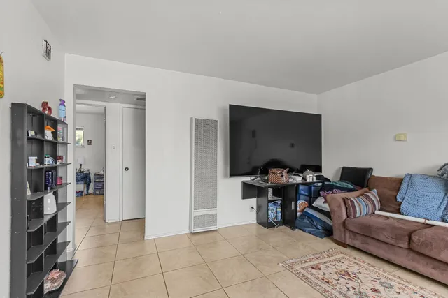 a view of a livingroom with furniture and lounge chair
