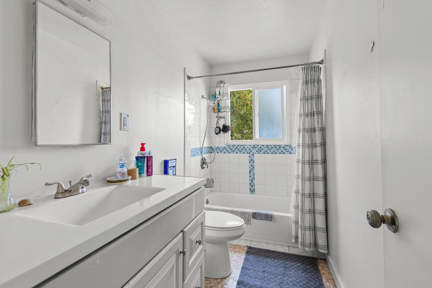 2123 15th Avenue Sacramento, CA 95822 - Photo 20 of 35 a bathroom with a sink toilet vanity and tub