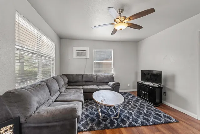 a living room with furniture and a window
