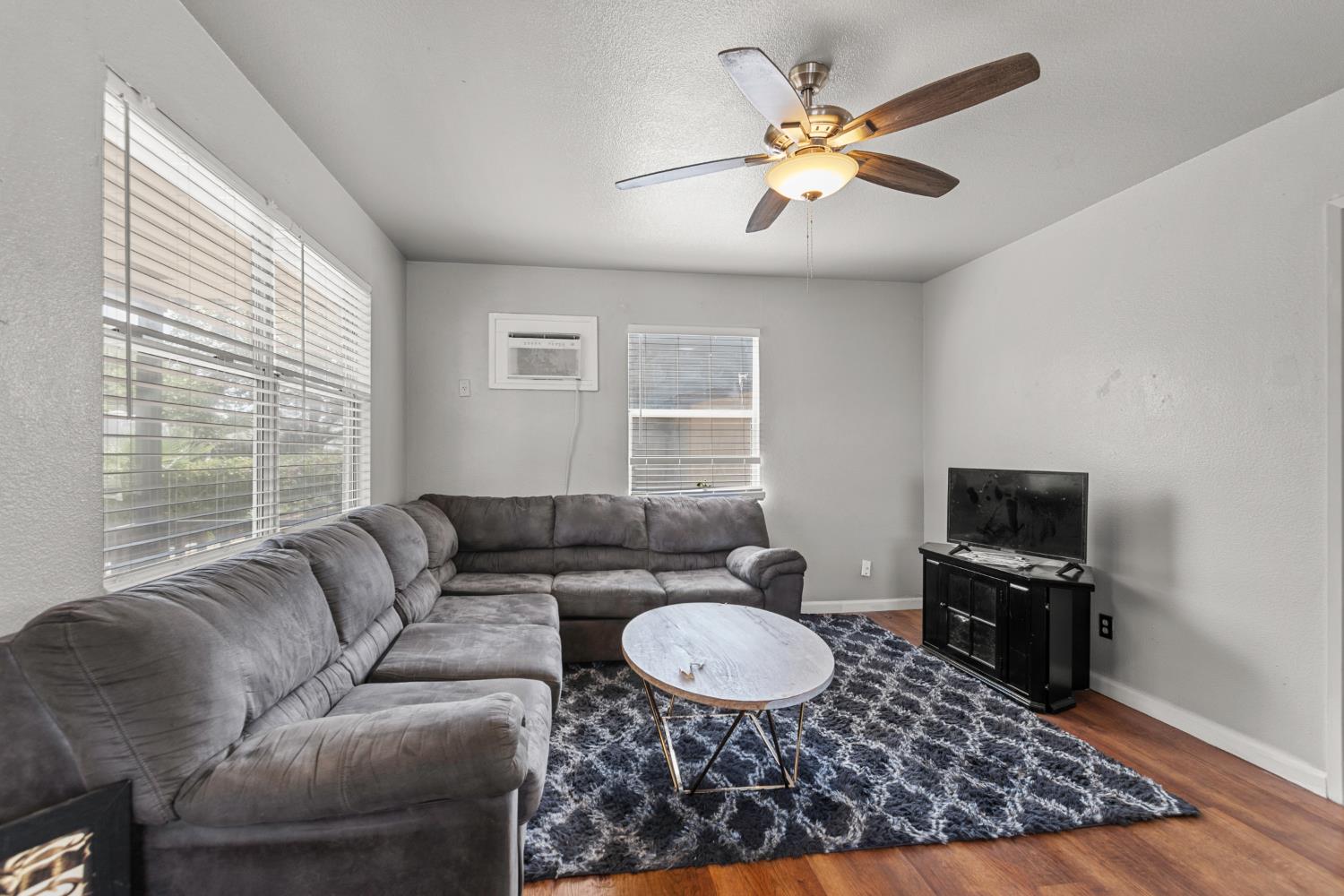 2123 15th Avenue Sacramento, CA 95822 - Photo 25 of 35 a living room with furniture and a window