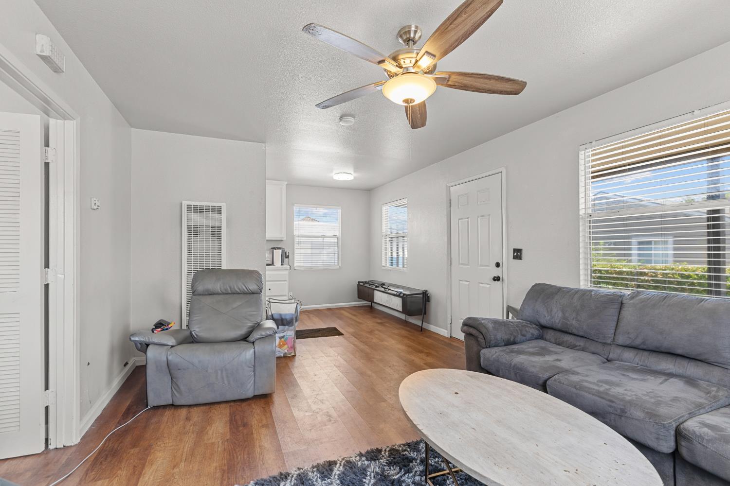 2123 15th Avenue Sacramento, CA 95822 - Photo 26 of 35 a living room with furniture and a large window