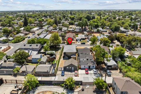 an aerial view of residential houses with outdoor space