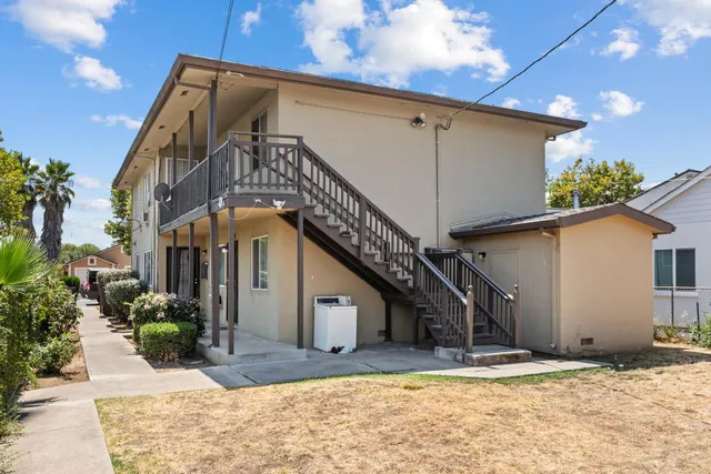 a view of a house with a snow in the background