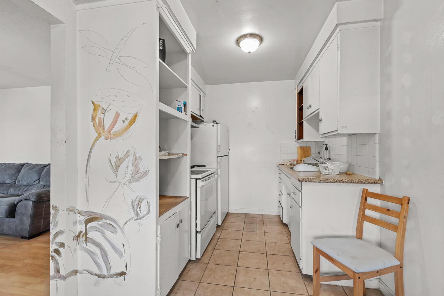 2123 15th Avenue Sacramento, CA 95822 - Photo 8 of 35 a kitchen with a sink cabinets and appliances