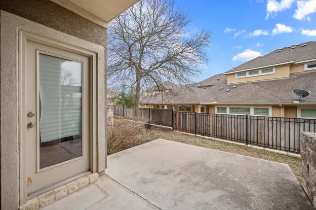 a view of backyard with a barn and a cactus tree