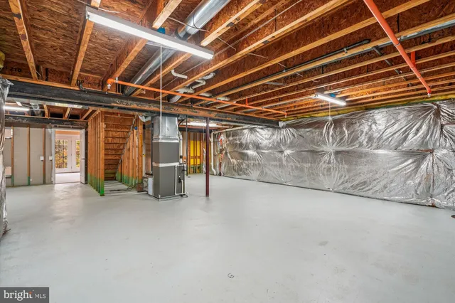 a view of an empty room with wooden walls
