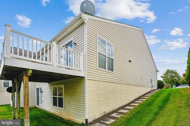 a view of a backyard with plants and a garden