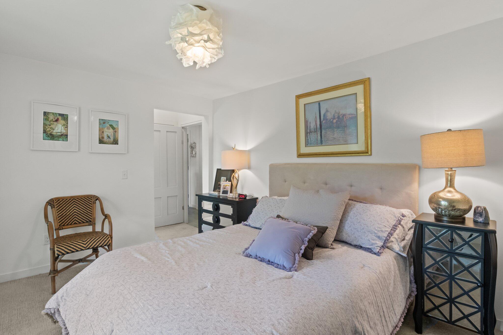 4 Pond Road, Unit B Truro, MA 02666 - Photo 11 of 40 a bedroom with a bed and a lamp on dresser