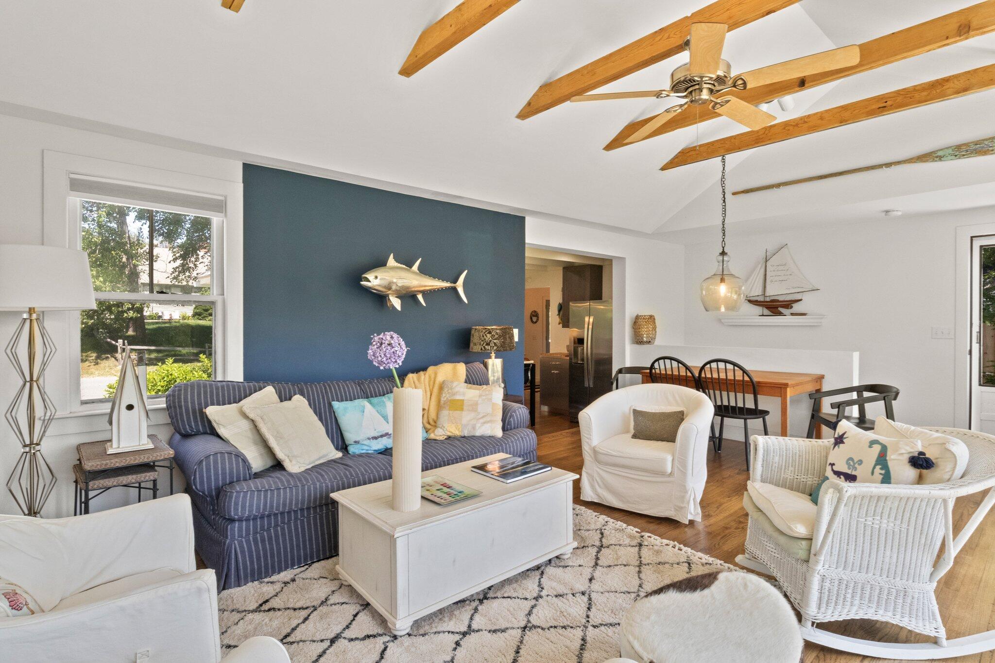 4 Pond Road, Unit B Truro, MA 02666 - Photo 12 of 40 a living room with furniture flowerpot and a chandelier