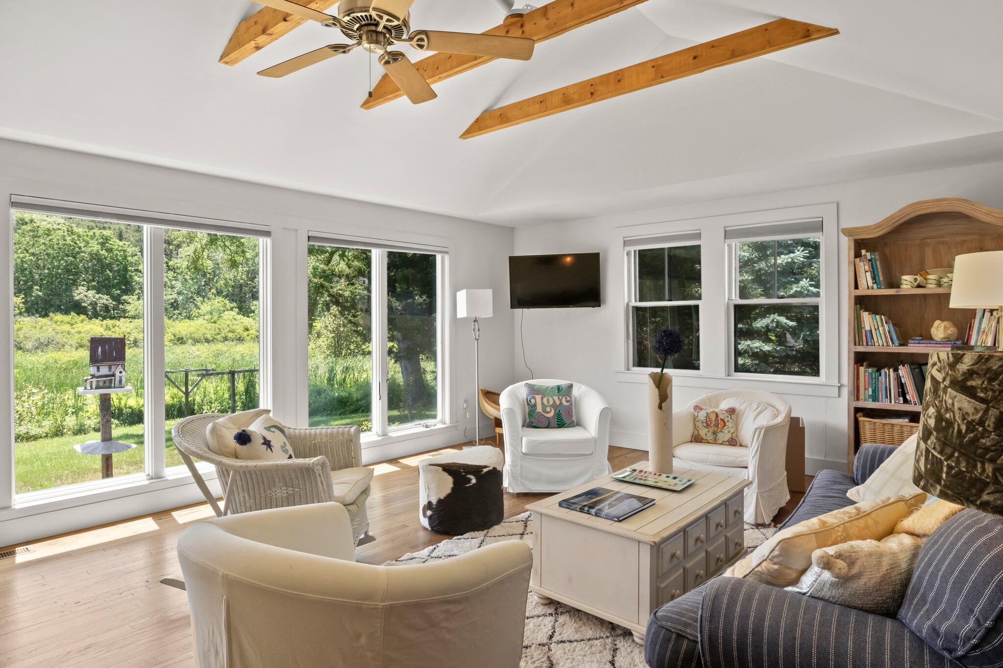 4 Pond Road, Unit B Truro, MA 02666 - Photo 13 of 40 a living room with furniture and a large window