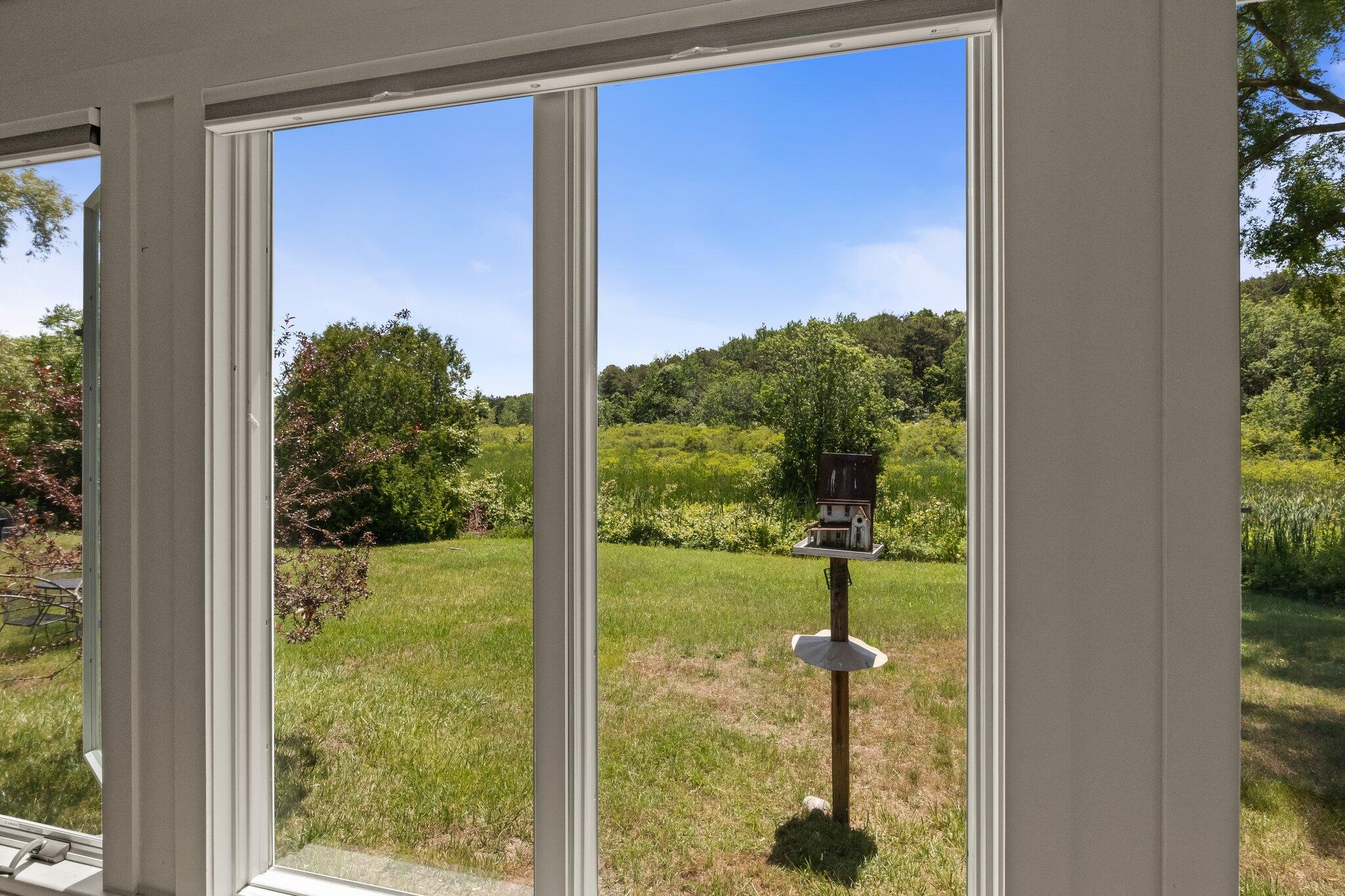 4 Pond Road, Unit B Truro, MA 02666 - Photo 15 of 40 a view of a garden from a window