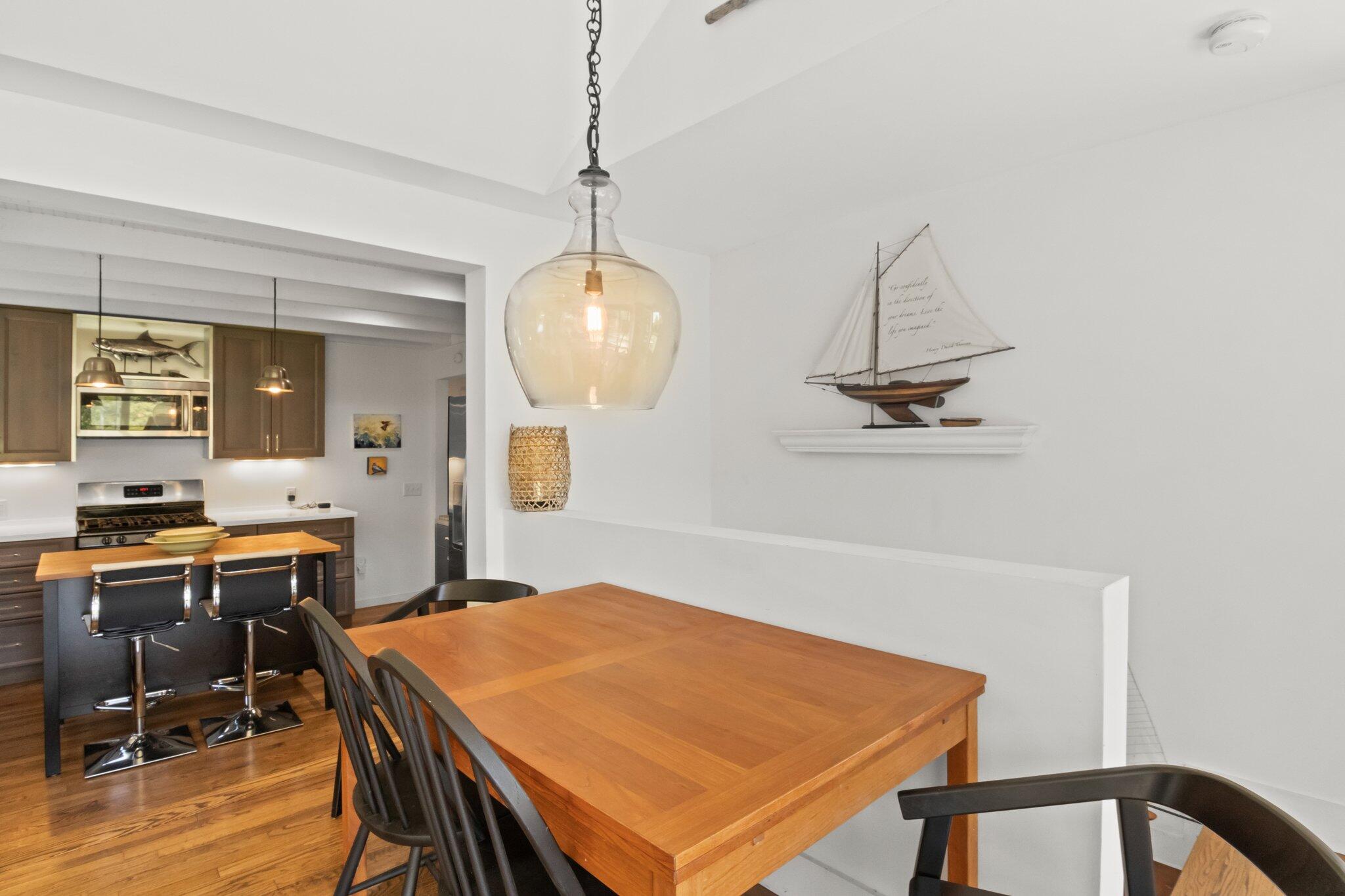4 Pond Road, Unit B Truro, MA 02666 - Photo 19 of 40 a view of a dining room with a table and chairs