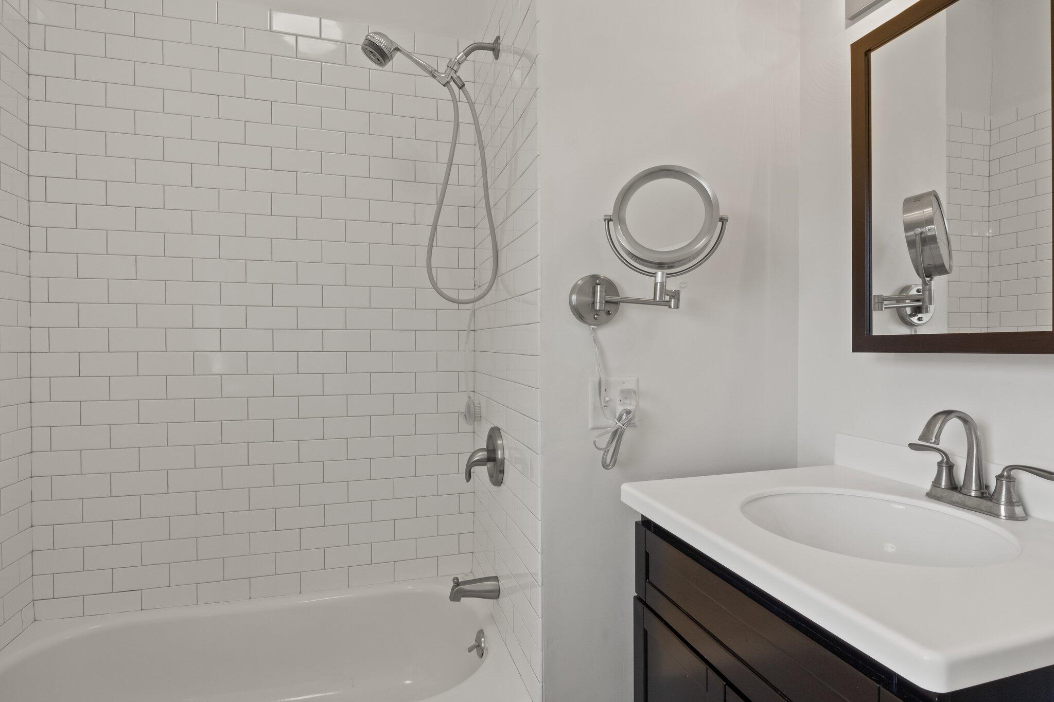 4 Pond Road, Unit B Truro, MA 02666 - Photo 23 of 40 a bathroom with a sink a toilet and shower