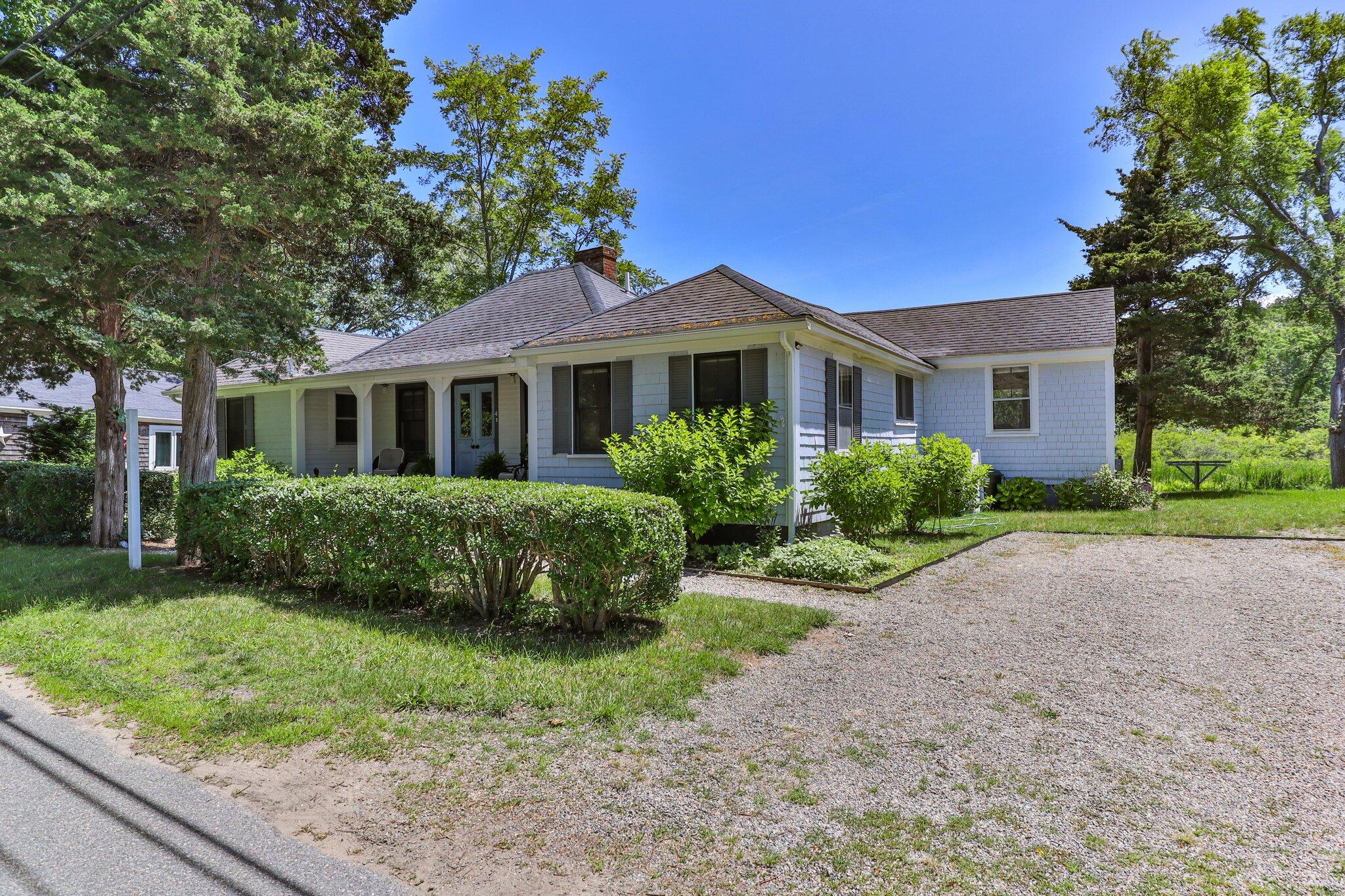 4 Pond Road, Unit B Truro, MA 02666 - Photo 3 of 40 a front view of house with yard and green space