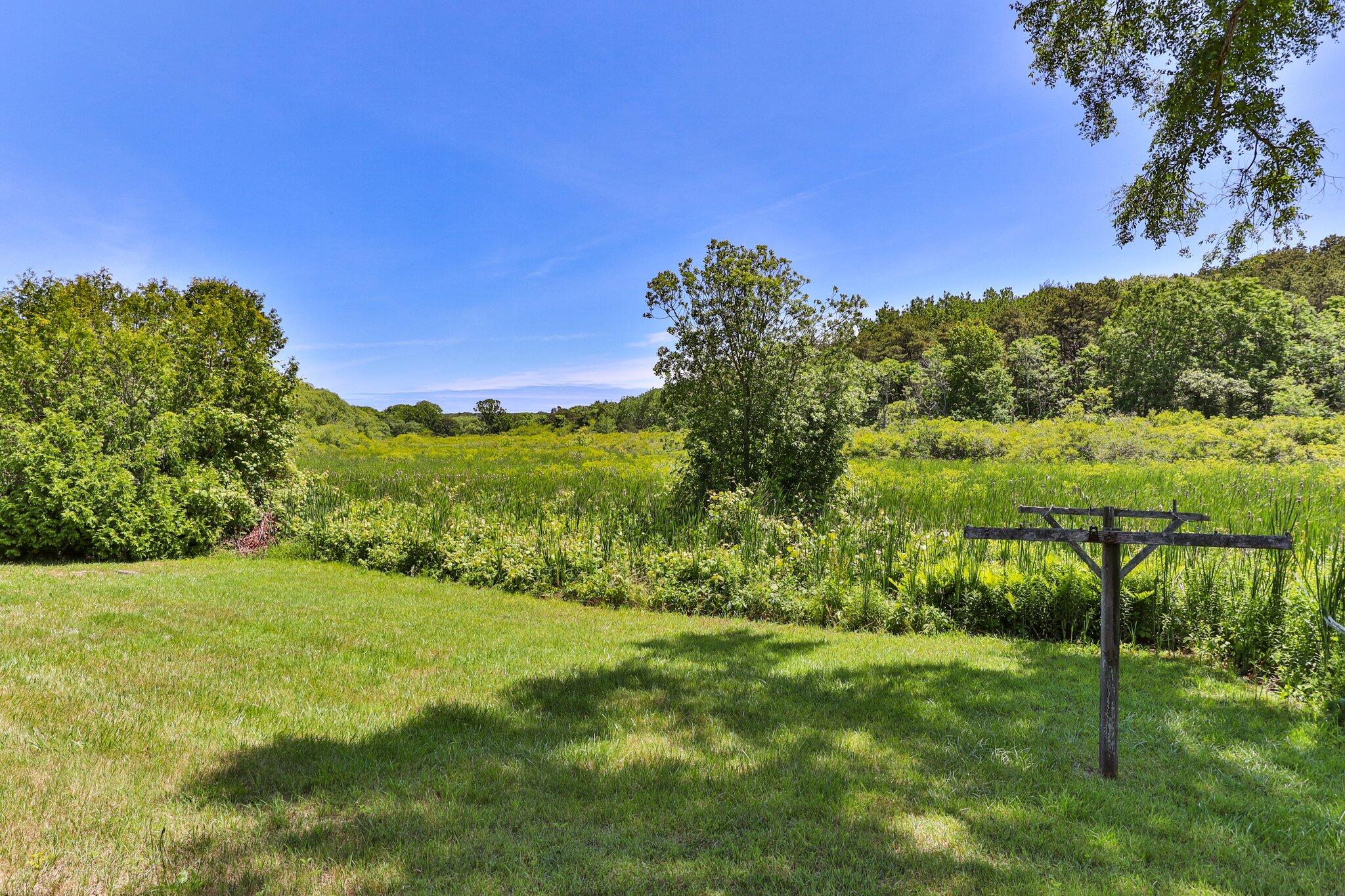 4 Pond Road, Unit B Truro, MA 02666 - Photo 33 of 40 a view of an outdoor space with a lake view