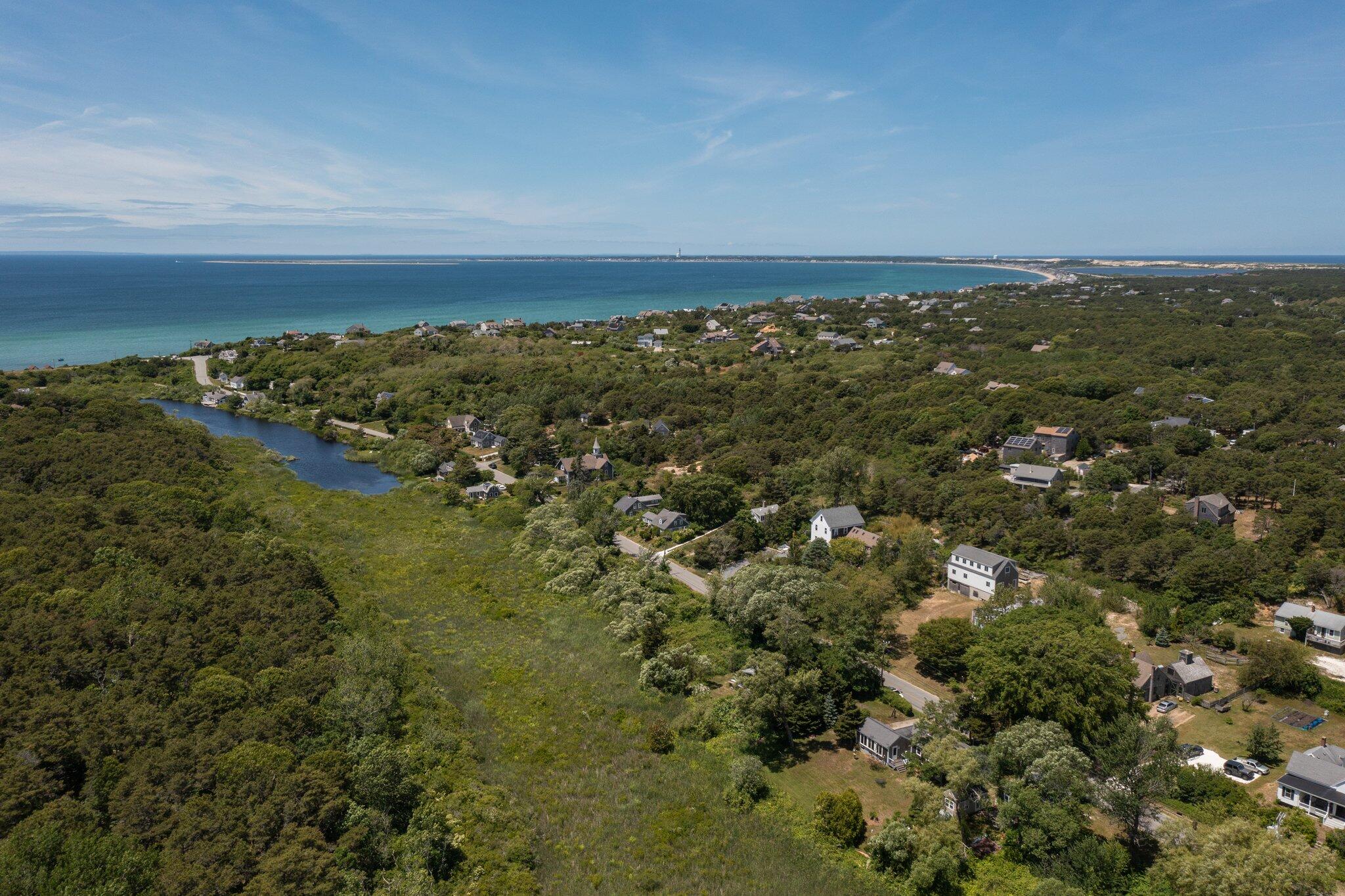4 Pond Road, Unit B Truro, MA 02666 - Photo 35 of 40 an aerial view of residential houses with outdoor space and trees