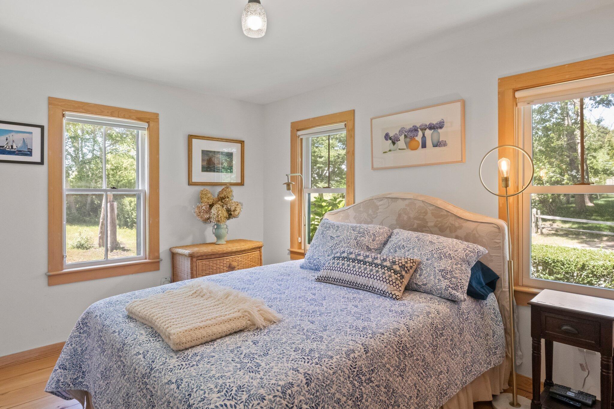 4 Pond Road, Unit B Truro, MA 02666 - Photo 10 of 40 a bedroom with a large bed and a window