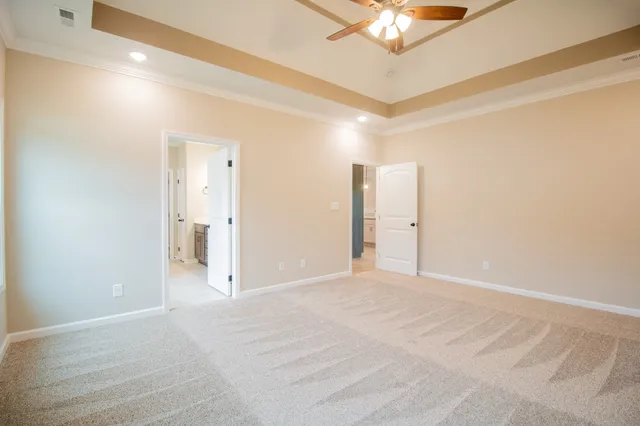 a view of a livingroom with a chandelier fan