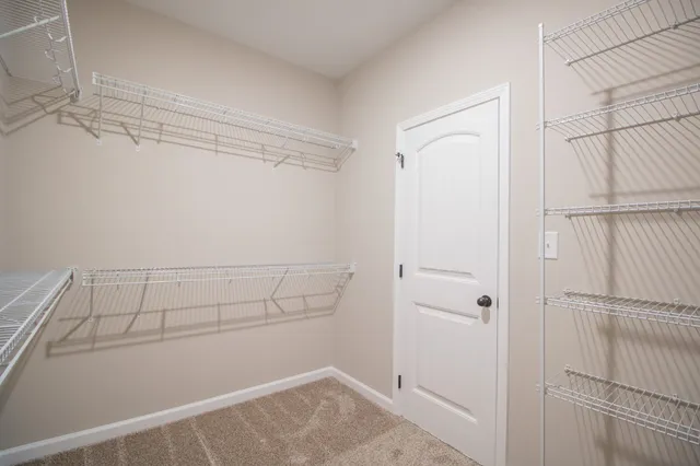 a view of a room with racks on the wall