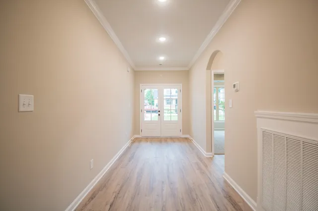 a view of hallway with wooden floor