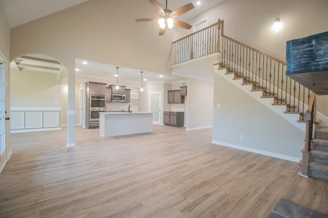 a view of a kitchen with a sink and a refrigerator