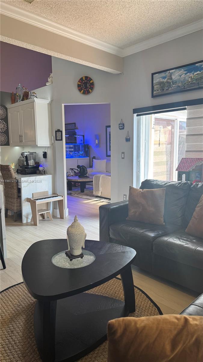 4220 Southwest 153rd Avenue Miramar, FL 33027 - Photo 13 of 34 a living room with furniture and a table