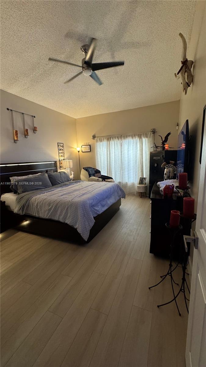 4220 Southwest 153rd Avenue Miramar, FL 33027 - Photo 15 of 34 a bedroom with bed and window