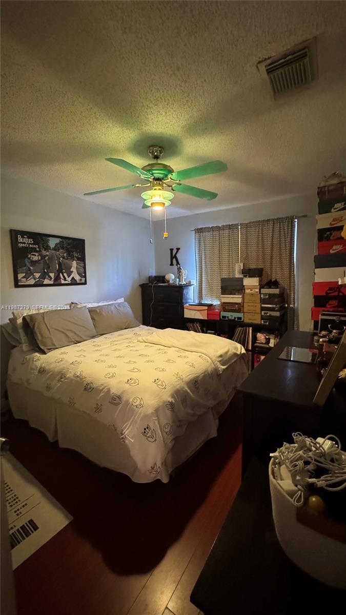 4220 Southwest 153rd Avenue Miramar, FL 33027 - Photo 26 of 34 a bed sitting in a bedroom next to a window