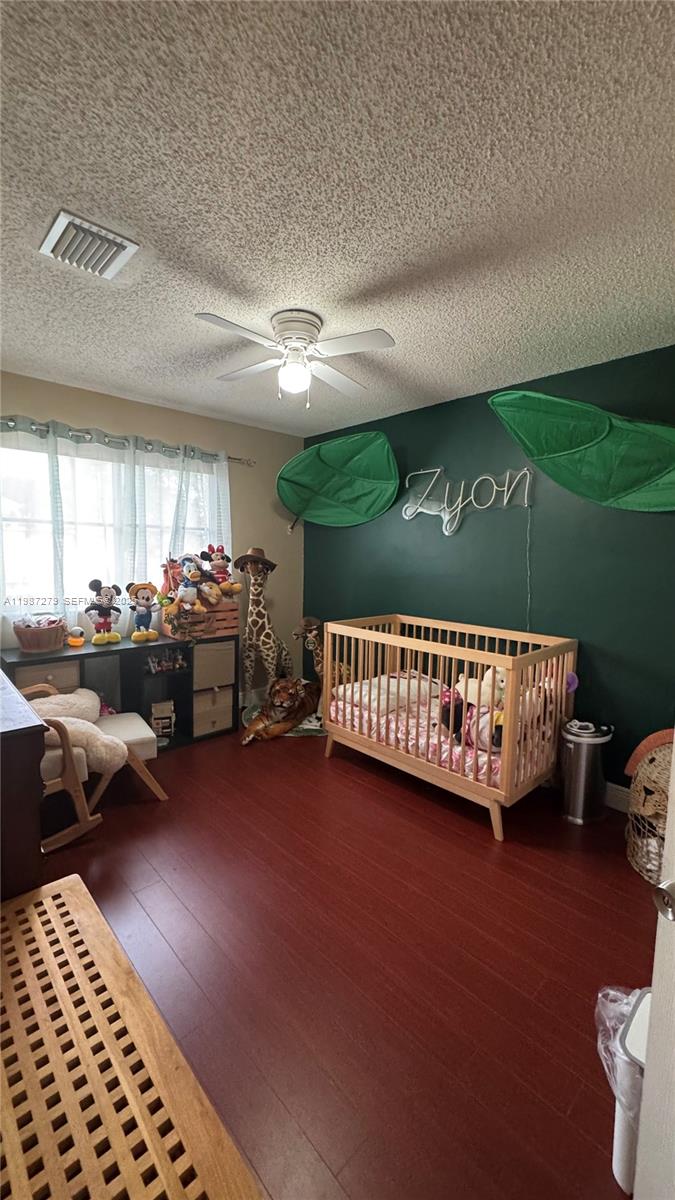 4220 Southwest 153rd Avenue Miramar, FL 33027 - Photo 28 of 34 a bed sitting in a room next to a window