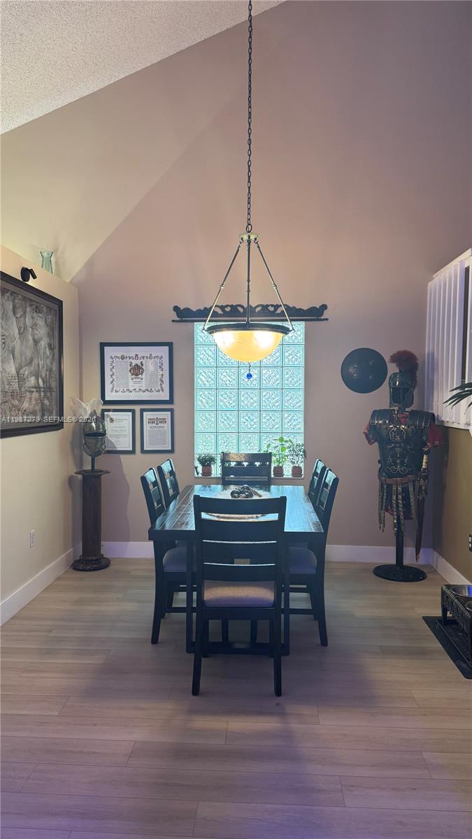 4220 Southwest 153rd Avenue Miramar, FL 33027 - Photo 6 of 34 a view of a dining room with furniture window and wooden floor