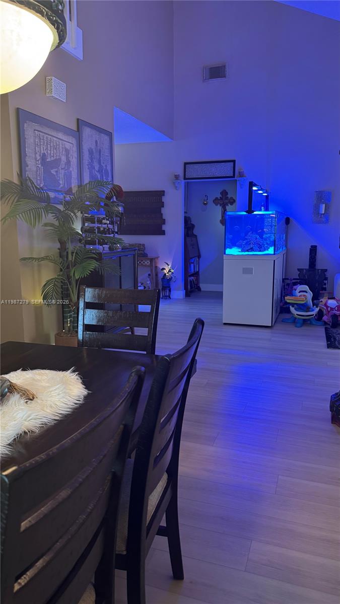 4220 Southwest 153rd Avenue Miramar, FL 33027 - Photo 7 of 34 a dining room with furniture and wooden floor