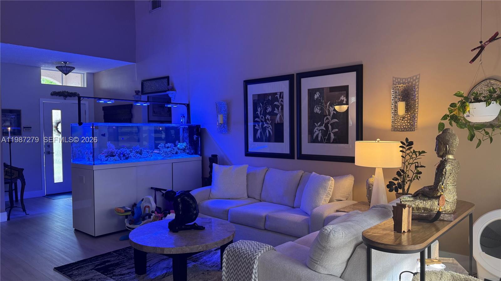 4220 Southwest 153rd Avenue Miramar, FL 33027 - Photo 9 of 34 a living room with furniture and a dining room