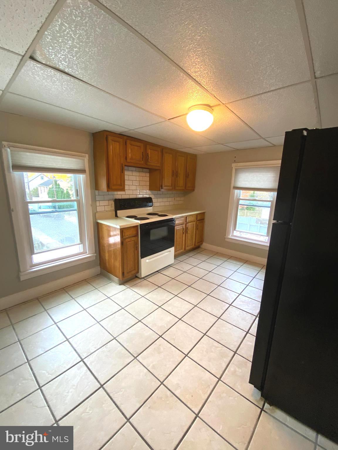 64 South Evans Street Pottstown, PA 19464 - Photo 14 of 31 a kitchen with stainless steel appliances granite countertop a stove a sink and a refrigerator
