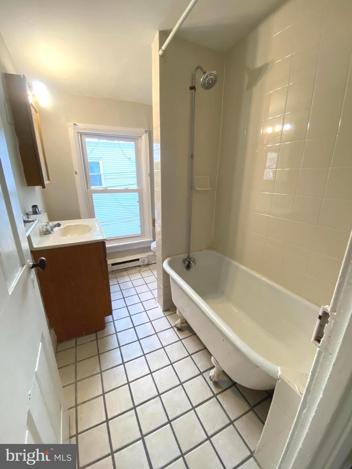 64 South Evans Street Pottstown, PA 19464 - Photo 20 of 31 a bathroom with a bathtub and a shower