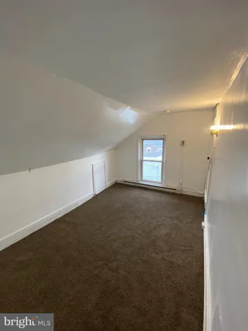 an empty room with staircase