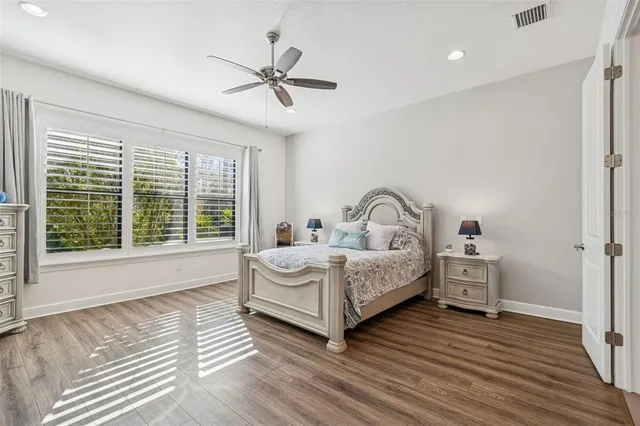 a kitchen with granite countertop a stove a sink and a refrigerator