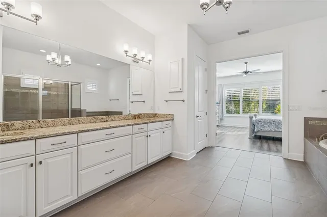 an aerial view of a house with a swimming pool outdoor space and swimming pool