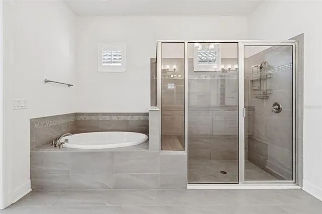 an aerial view of residential houses with outdoor space and swimming pool