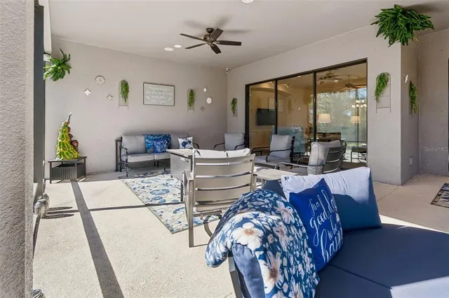 a front view of a house with a garden and a tree