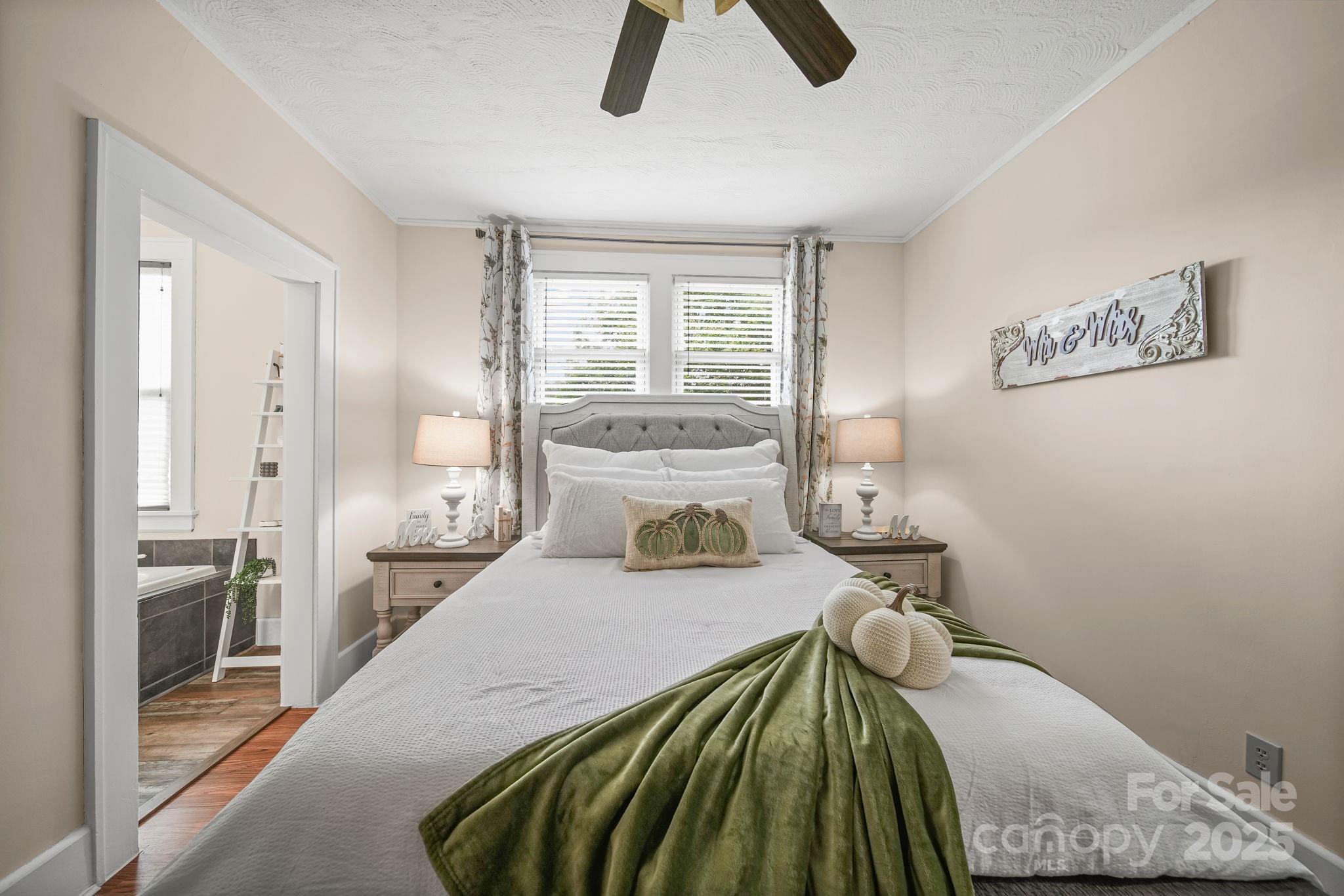 745 Dukeville Road Salisbury, NC 28146 - Photo 24 of 40 a bedroom with a bed and a large window