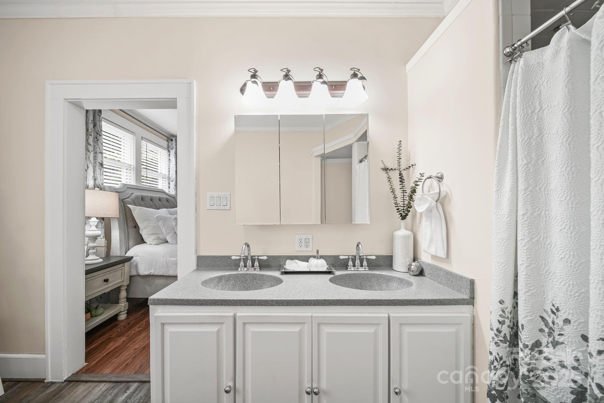 745 Dukeville Road Salisbury, NC 28146 - Photo 25 of 40 a bathroom with a sink vanity and a mirror