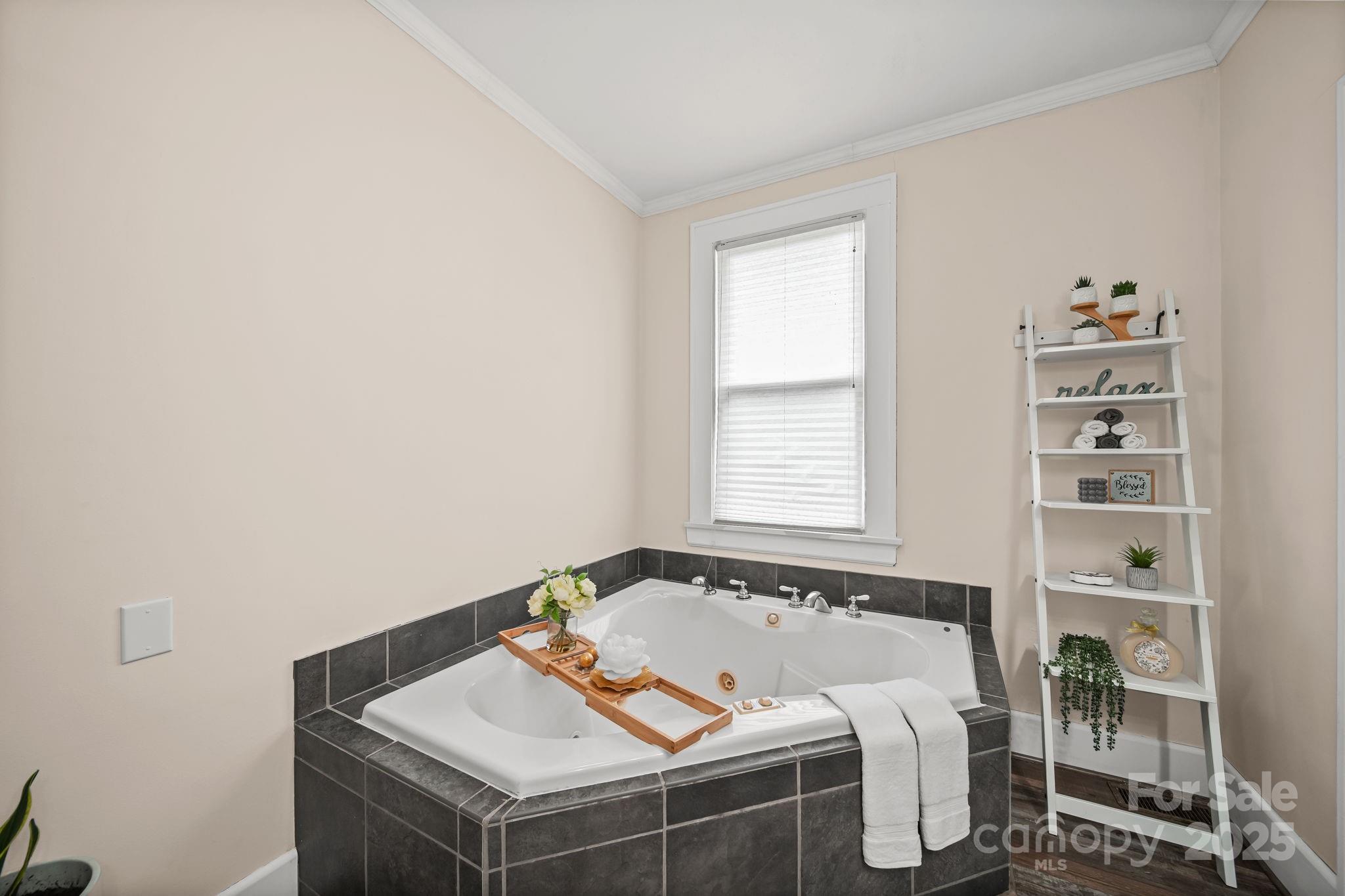 745 Dukeville Road Salisbury, NC 28146 - Photo 26 of 40 a bed sitting in a bedroom next to a window